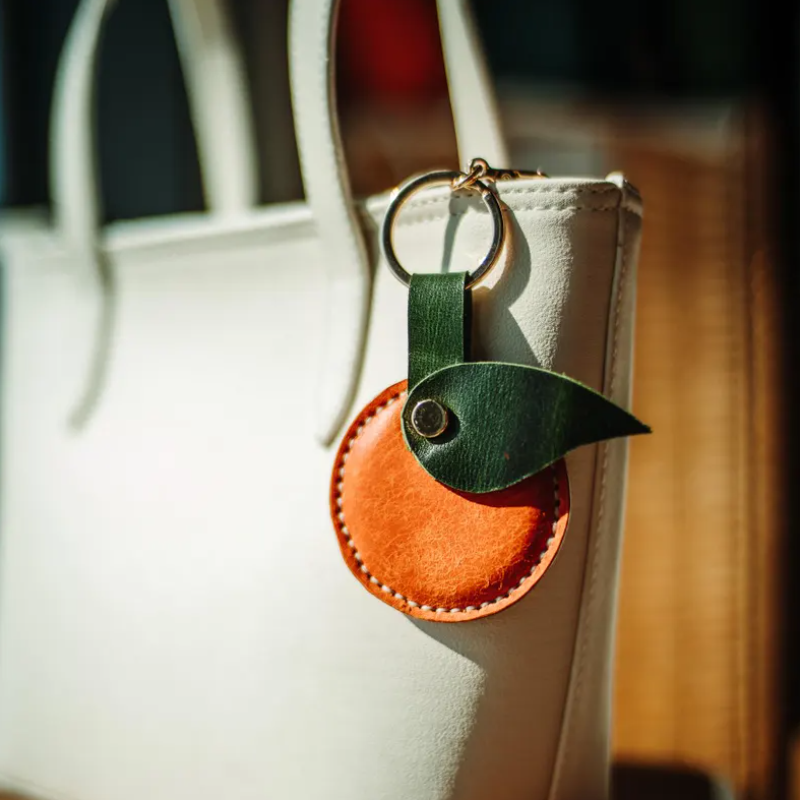 Wholesale leather orange keychains inspected before promotional gift shipment Wholesale leather orange keychains inspected before promotional gift shipment